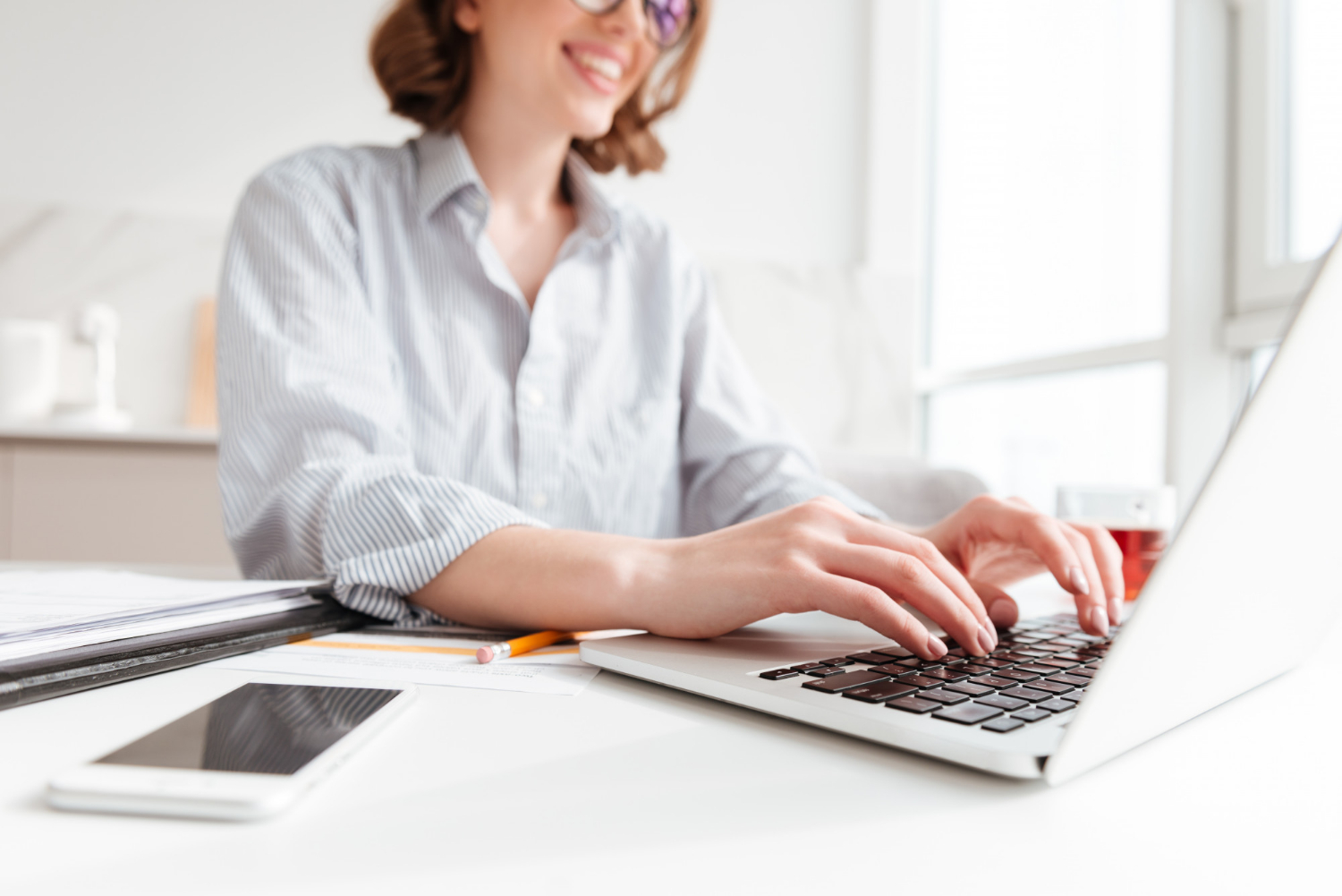 brunette-woman-typing-email-laptop-computer-while-sitting-home-selective-focus-hand